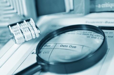 Magnifying glass over text "Due Date"
