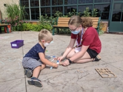 VolunTeen working with child